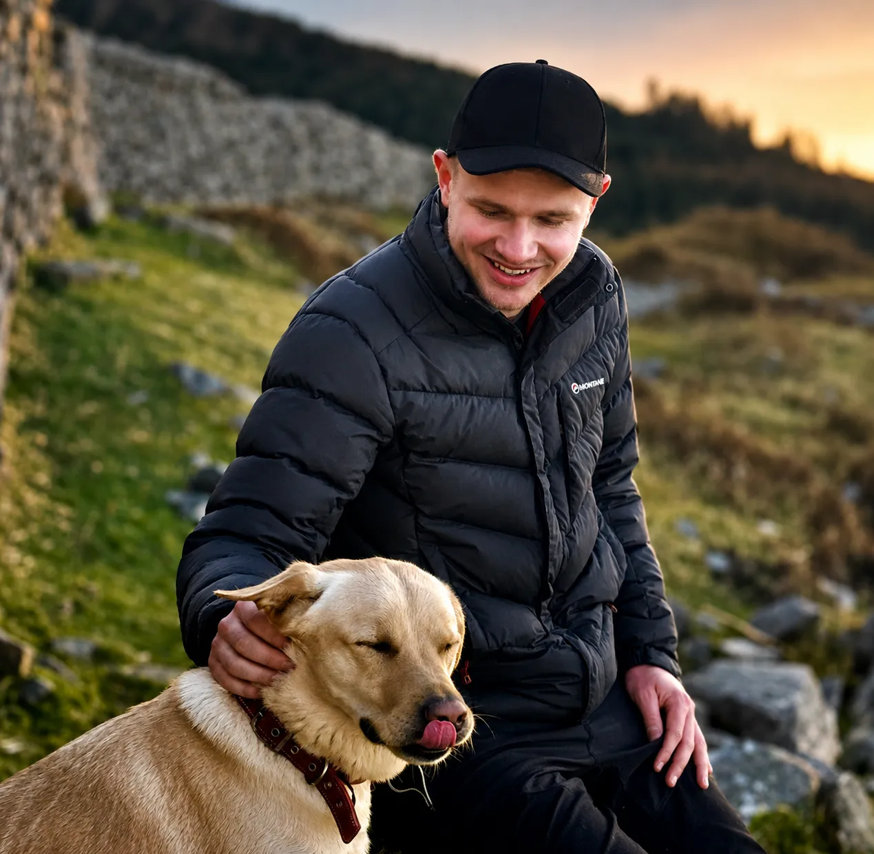 Luke McIlwaine outdoors with his dog at golden hour